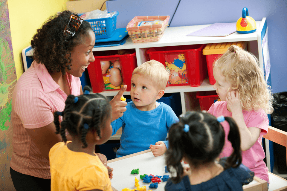 A teacher working with young children