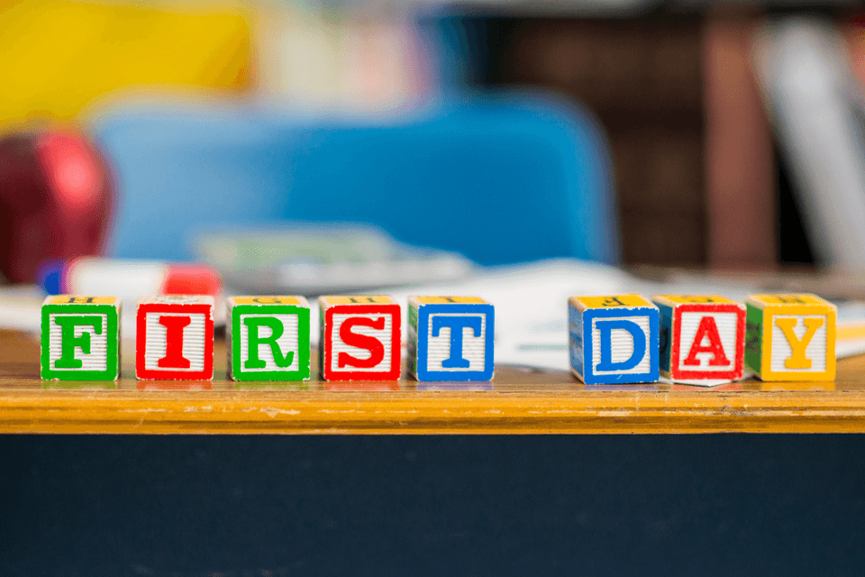 Alphabet blocks spelling FIRST DAY