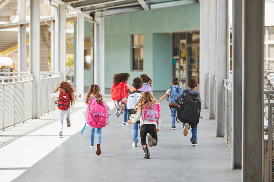 Students walking down a school hallway